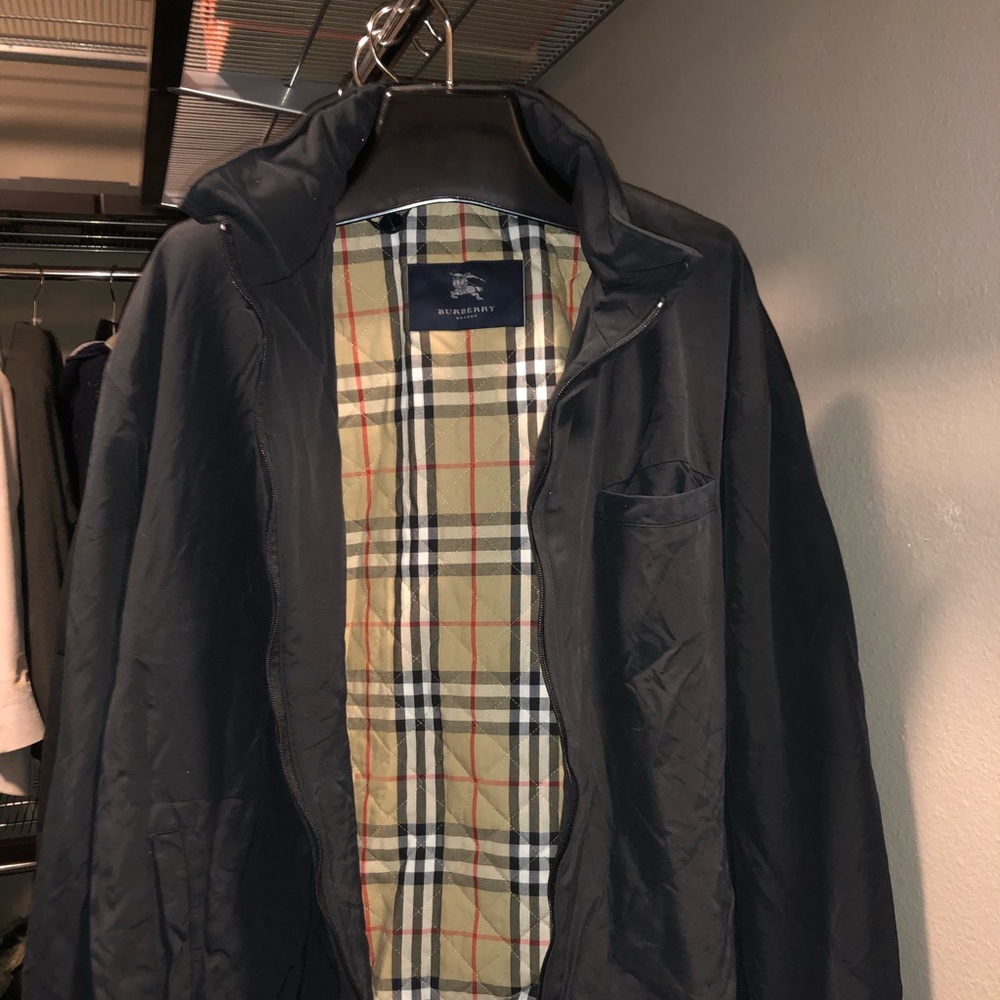 Burberry mid length insulated rain coat.